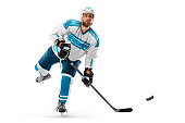 Athlete in action. Professional hockey player on white background. Sports emotions. Hockey concept