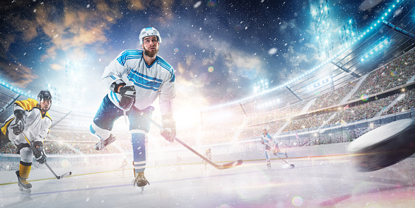 Athlete in Winter Stadium. Professional hockey player on action. Decisive throw of the puck. Sports emotions. Sport concept