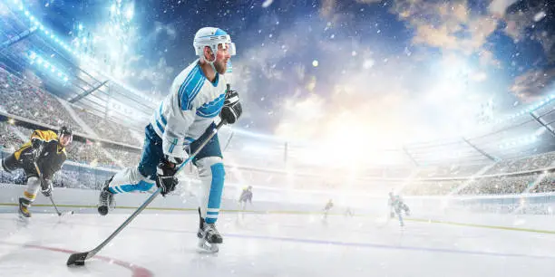 Professional hockey player ready to attack in ice. Side view. Sport concept. Athlete in action. Winter
