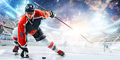 istock Sport. High concentration. Professional hockey player ready to attack in ice. Sports emotions. Concept of action, team sport game 1358335073
