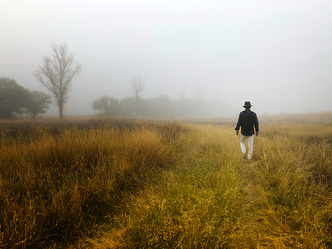 Man Hiking Foggy West Texas Grasslands