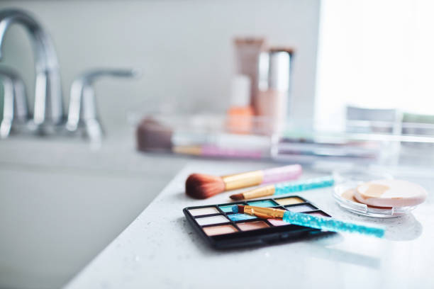 istock Make-up collection and eye-shadow palette in plastic containers in bright modern bathroom 1358349870