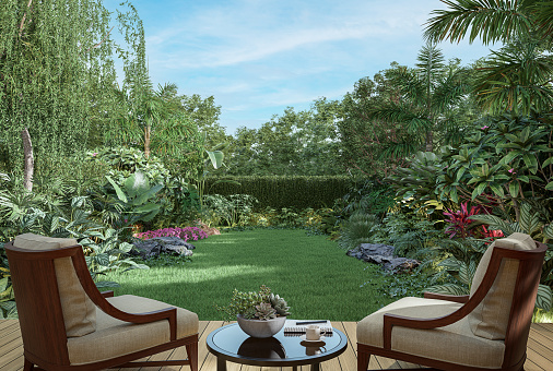 Wooden terrace with tropical style garden 3d render decorate with wood and fabric chair