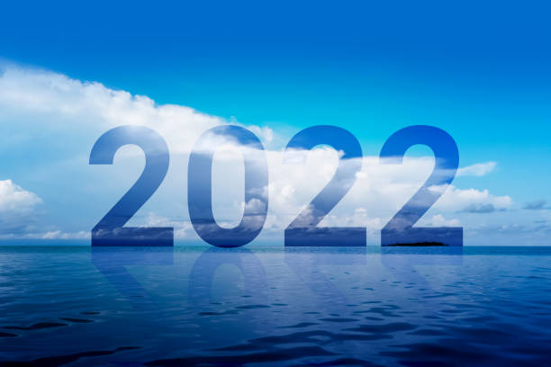 Year 2022 and its reflection in the backdrop of a beautiful sea view stock photo
