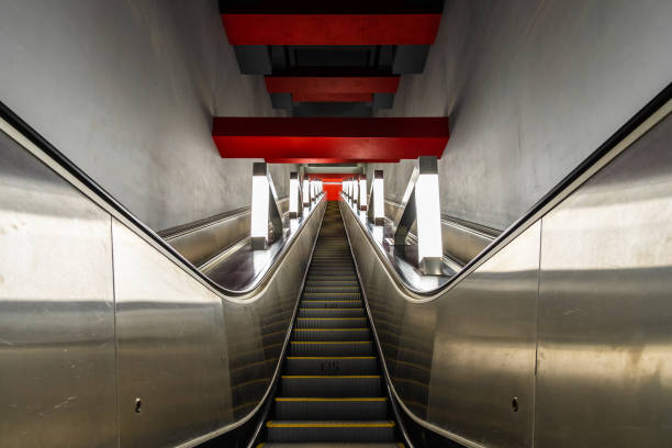 istock Bottom view of the rising steps of a modern escalator. 1358359452