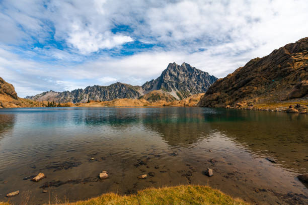 istock The Red Granite Cliffs that Line Ingalls Lake are Reflected with Mount Stuart in Calm Waters 1358359491