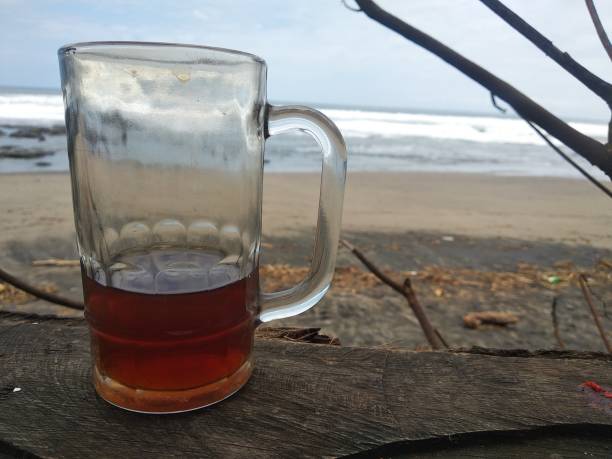 istock tea drink glass on the beach 1358361978