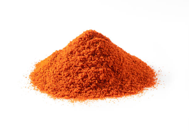 istock Red pepper powder on a white background 1358366487