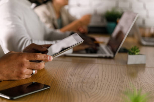 istock Businessman using digital tablet during a meeting with colleagues 1358368142