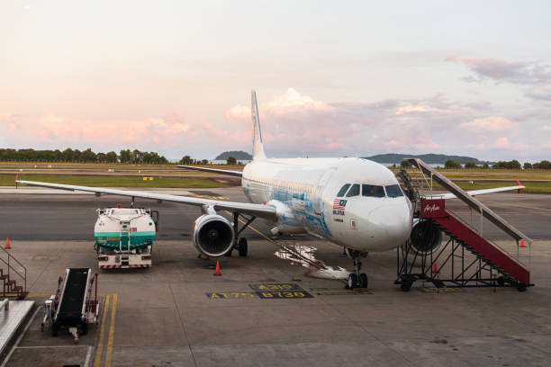 An Air Asia plane at the Kota Kinabalu International Airport stock photo