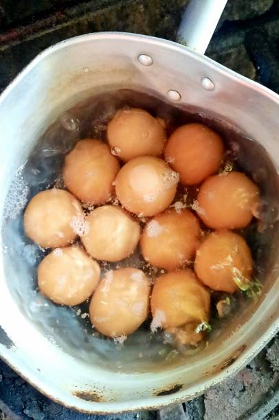 istock Boiling Eggs on stove - food preparation. 1358369259