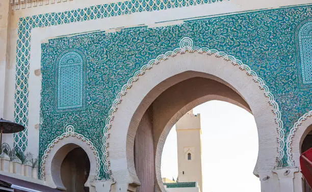 Bab Bou Jeloud (also Bab Boujloud) an ornate city gate and main western entrance to Fes el Bali, the medina of the old city of Fez, Morocco