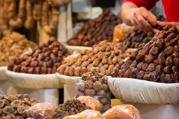 Nutmegs and raisins, dry fruits from a moroccan market shop in the Medina of Fes, Morocco