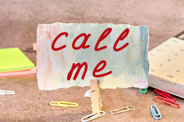 istock Call me a note on the table attached to a clothespin 1358374150