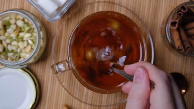 Making hot tea with chamomile and rosebay