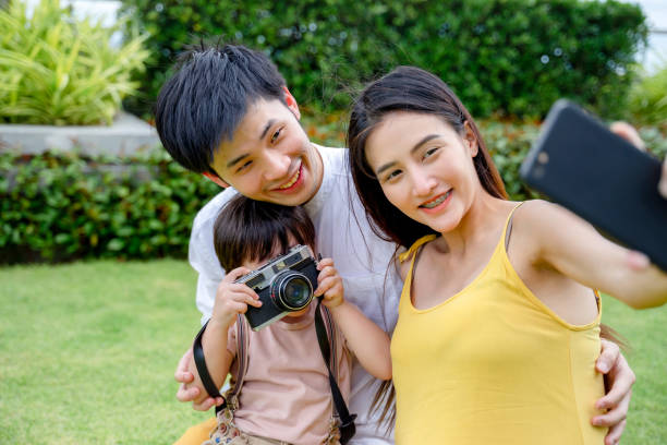 istock happy asian family. 1358385282