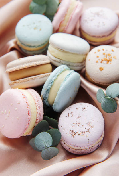 istock Beautiful colorful tasty macaroons on a textile background 1358386043