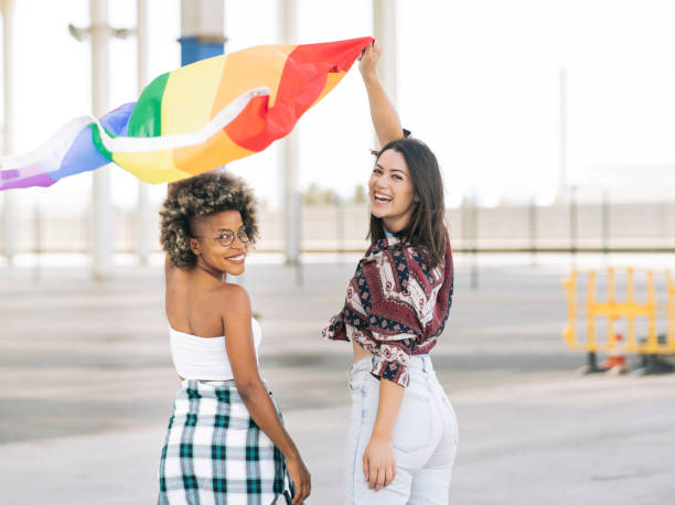 istock multiethnic friends with multicolored flag lgbt rights 1358389573