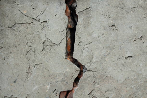 istock A crack in a brick wall. Cement. Plaster. Background. 1358390724