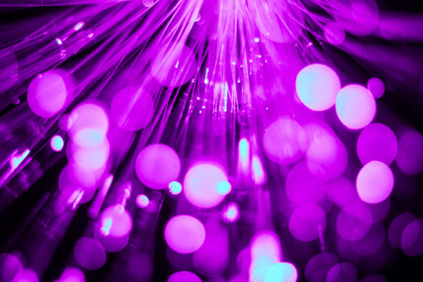 istock Luminous fiber optic light guides, dots and lines. Selective focus. Abstract background. 1358391768