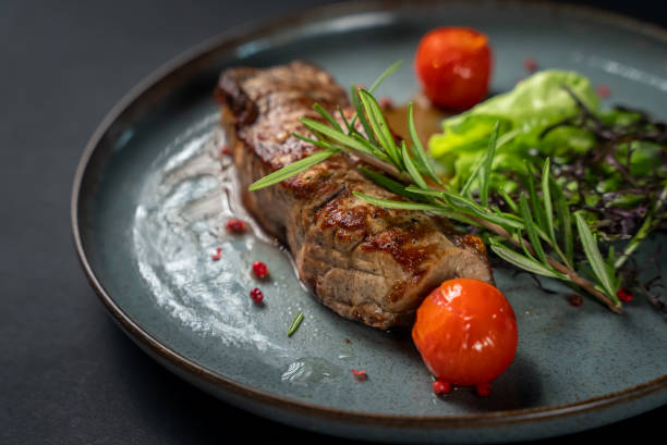 istock Juicy steak medium rare beef with spices, 1358394366