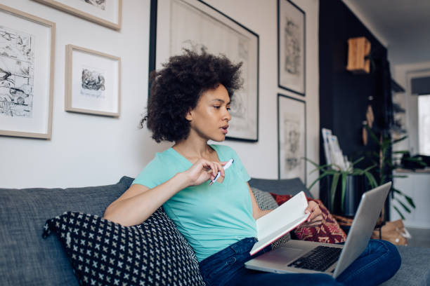 istock Young African American freelancer is making business strategy at home 1358399378