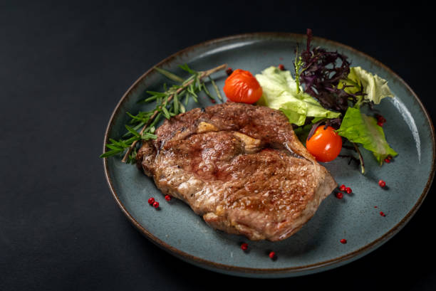 istock Juicy steak medium rare beef with spices, 1358400368