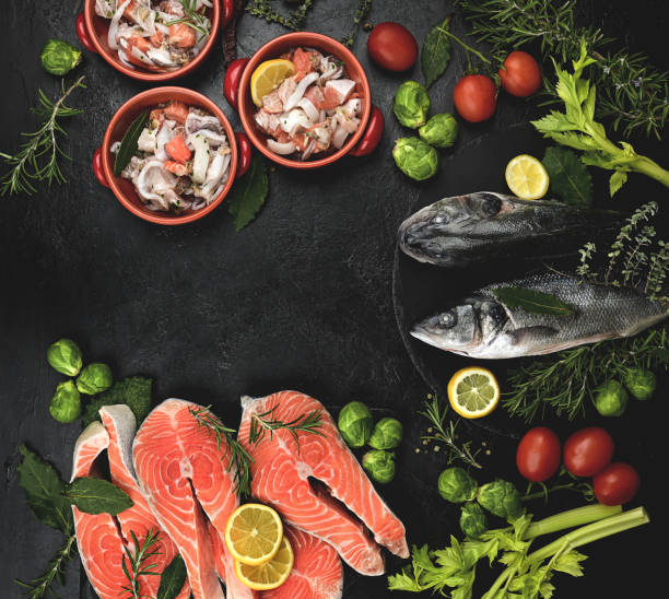 istock Fresh seafood on black stone. 1358406715