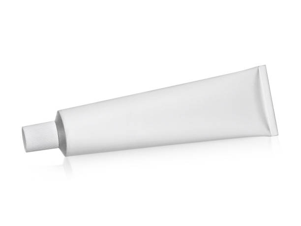 istock Aluminum cream white tube isolated on white background 1358408369
