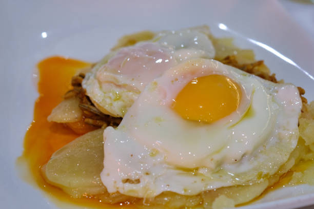 istock Fried egg with lots of potatoes 1358410365