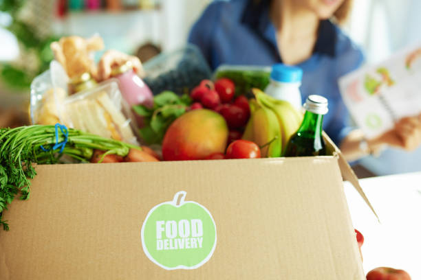 istock Closeup on woman with food box in kitchen 1358411922