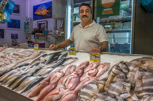Canary Islands, Spain - December 17, 2015: Fishmonger in the market of the city of La Laguna in Tenerife