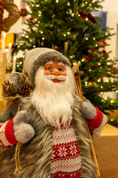 istock Santa Claus doll and Christmas tree 1358411994
