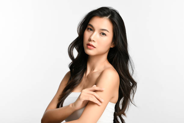 Beautiful young asian woman with clean fresh skin on white background, Face care, Facial treatment, Cosmetology, beauty and spa, Asian women portrait. Beautiful young asian woman with clean fresh skin on white background, Face care, Facial treatment, Cosmetology, beauty and spa, Asian women portrait. asian beauty woman stock pictures, royalty-free photos & images