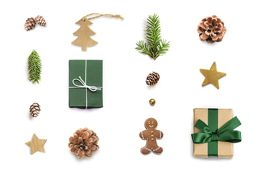 Christmas composition. Gift boxes, decorations, fir branches and pine cones on white background. View from above. Flat lay mock up