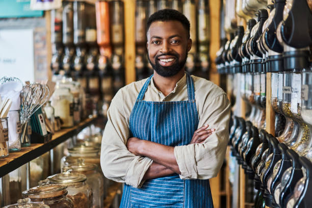 Shot of a young male business owner in his grocery store stock photo