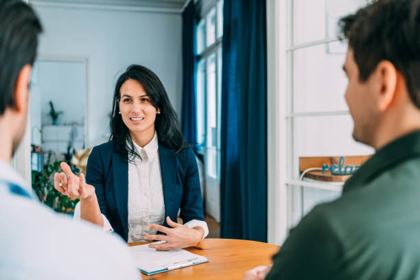 istock Group of business persons talking in the office. 1358414813