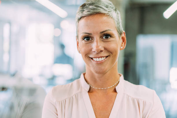 istock Confident businesswoman in modern office. 1358414847