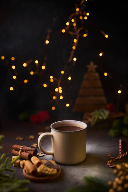 istock mug of hot chocolate surrounded by Christmas decorations 1358415094