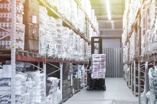 istock logistics transport center with racks and loader 1358416377