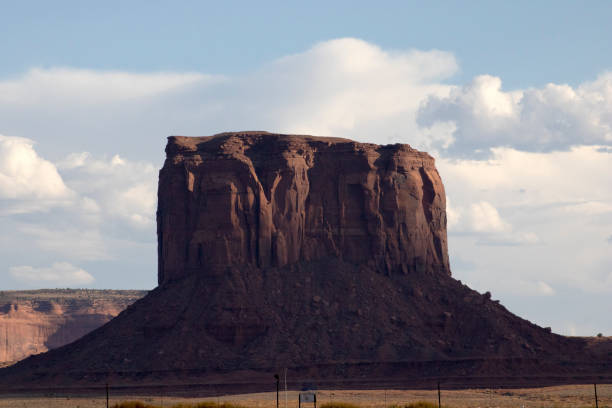 dark side of mitchell butte in monument valley utah - mitchell butte imagens e fotografias de stock