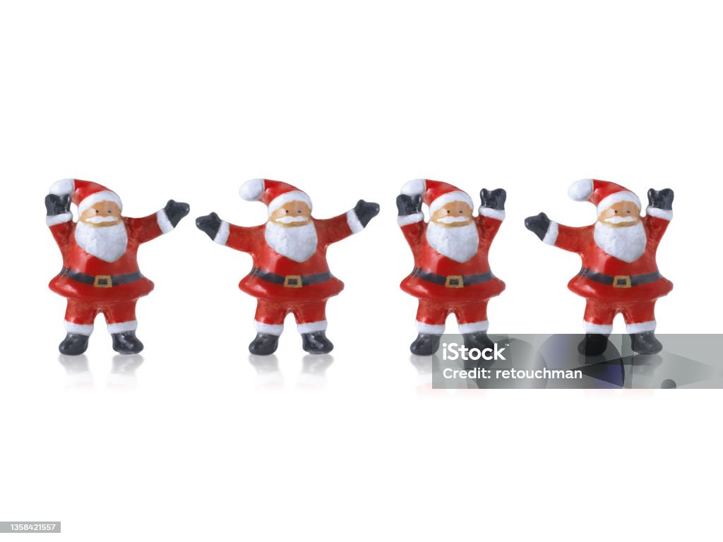 Santa claus Cute ceramic dolls statues decorations in Merry Christmas with on white background Christmas Market Stock Photo