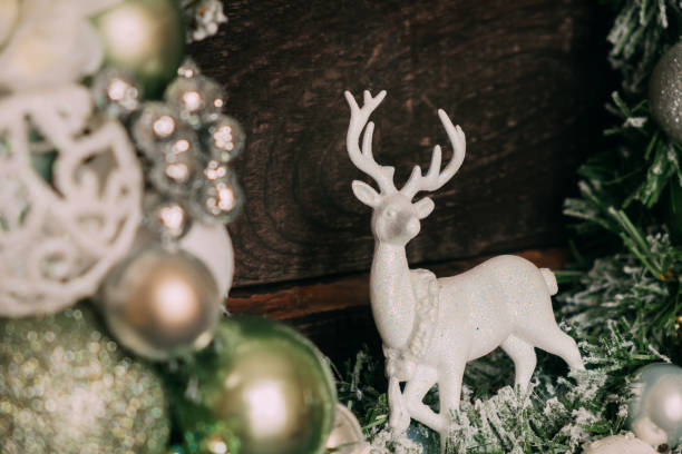 istock White deer on a New Year's wreath close-up. 1358423224