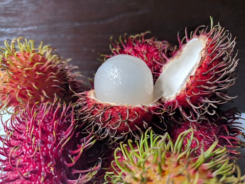 Exotic fruits for sale at a Borneo market. Rambutan, Dragon fruit, passion fruit, mango