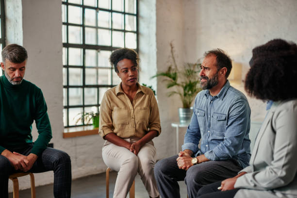 istock Discussion among the diverse members of support group 1358426028