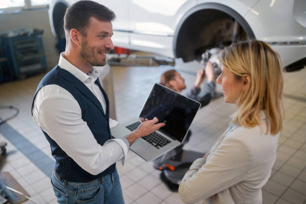 istock Caucasian woman getting her car fixed 1358426460
