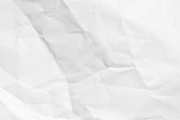 istock Grunge wrinkled white color paper textured background 1358427401