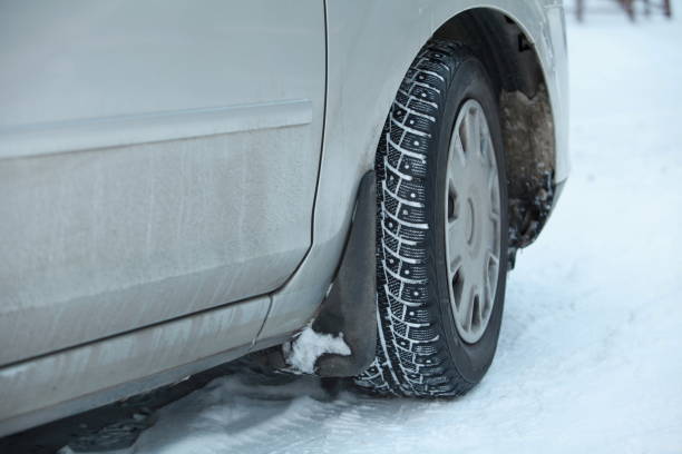 istock car wheel with winter studded tires 1358427519