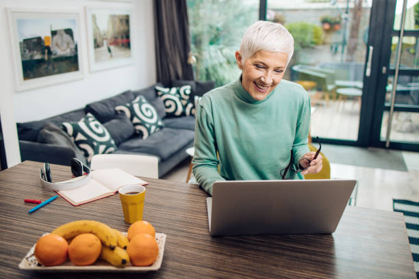 istock Senior entrepreneur working from home 1358427523