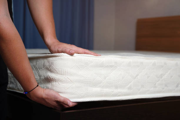 istock Young man choosing new orthopedic mattress close up 1358428627